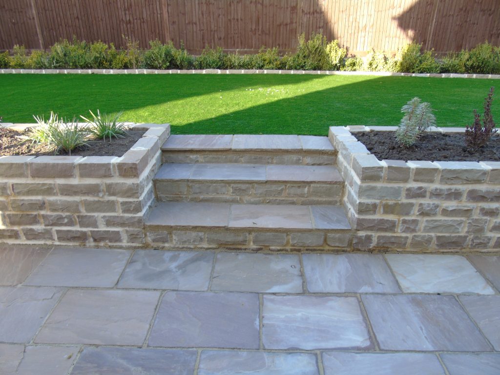 Garden retaining wall with paving